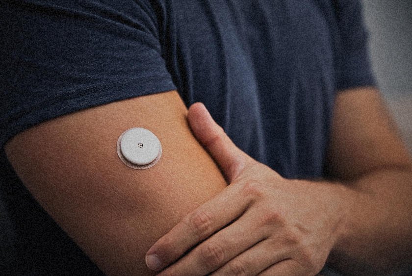 Continuous glucose monitor on a person's arm