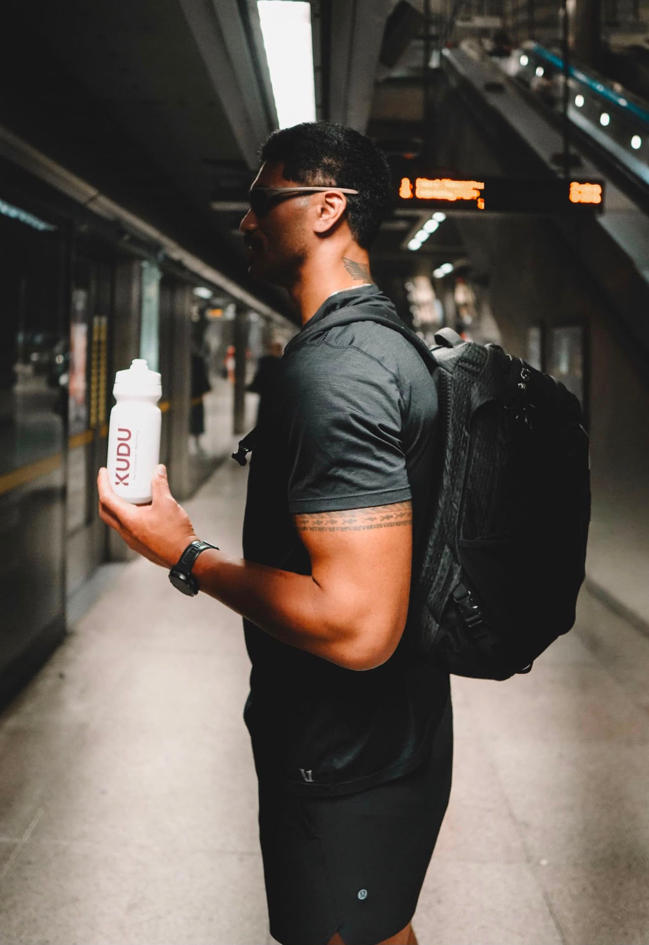 KUDU Water Bottle in hand on the commute