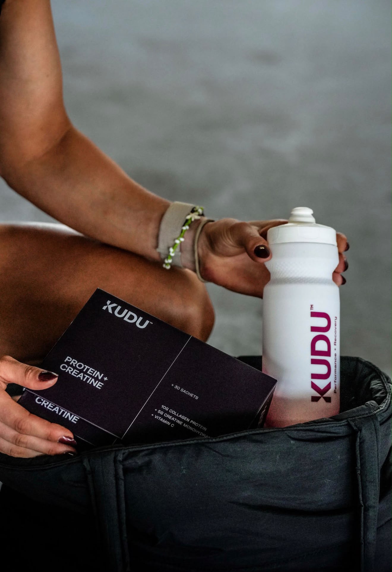 KUDU Water Bottle packed in a sports bag with KUDU sachets